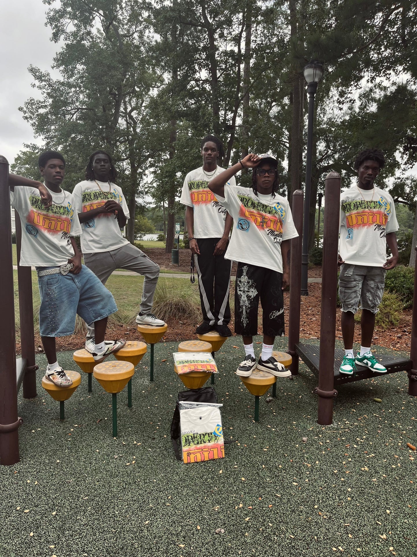 Uni1y Retro Street Tee group shot at park playground